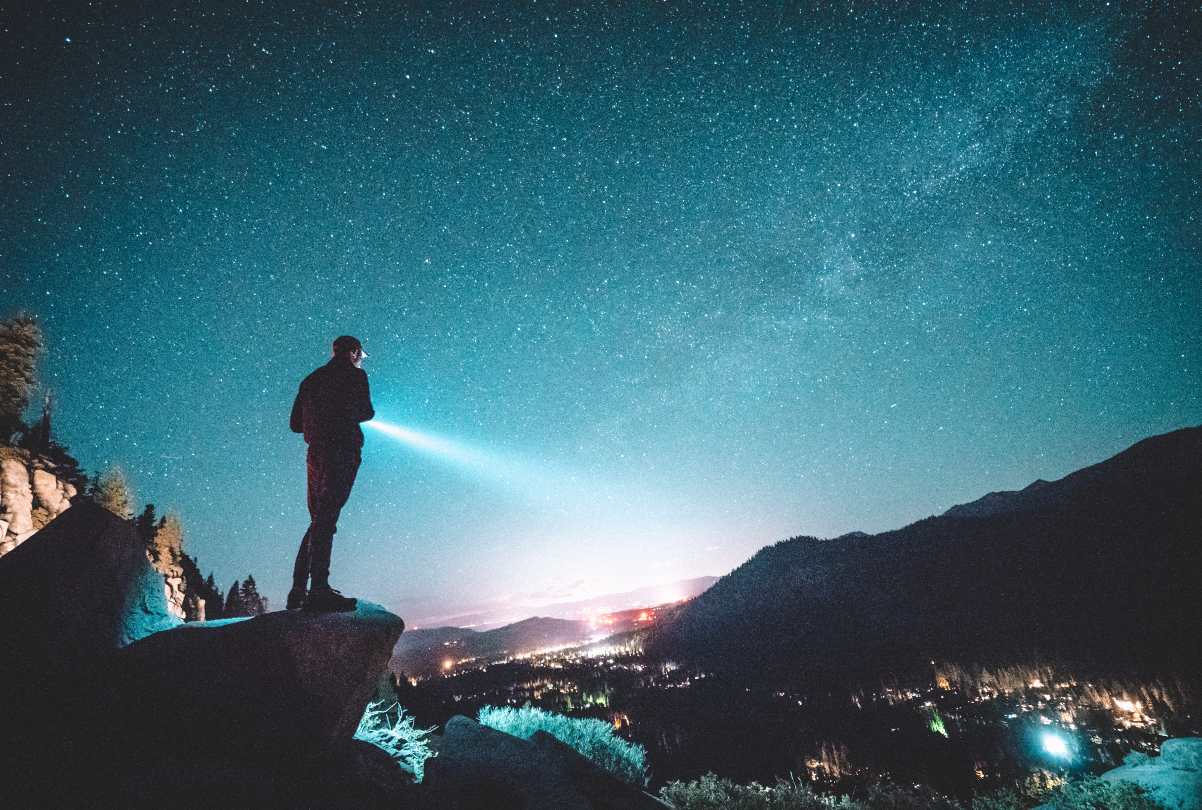 Man searches in the dark with a torch